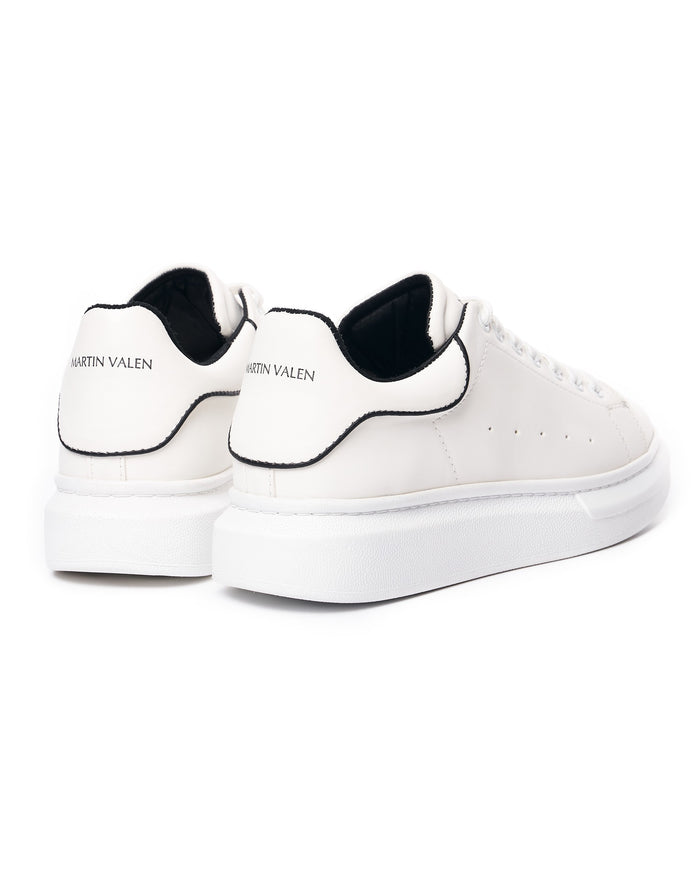 Martin Valen men's chunky white sneakers rear three-quarter view showing black heel trim and Martin Valen logo on the heel