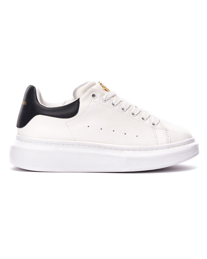 Martin Valen men’s white sneaker side profile with black heel, visible laces and thick high sole