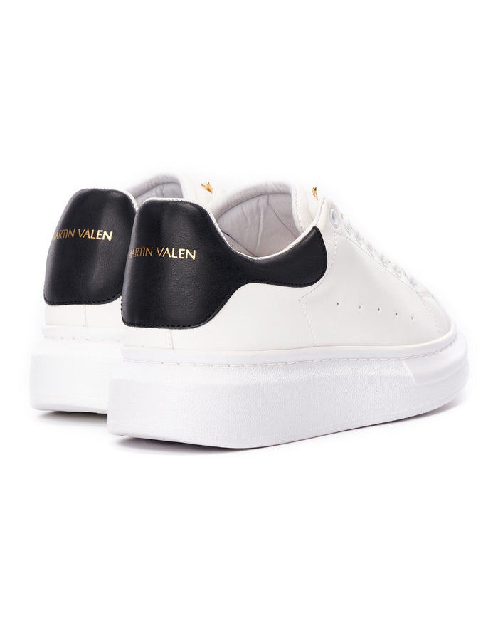 Martin Valen white sneakers with black heel tab, rear close-up showing black heel and gold logo