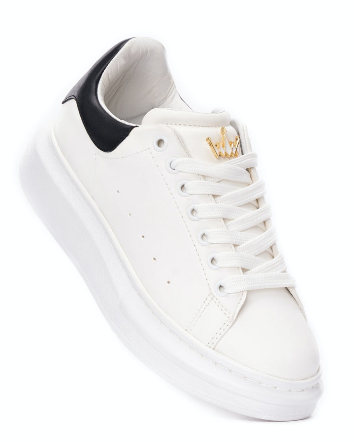 Martin Valen white sneaker top view showing laces, tongue and small gold crown ornament