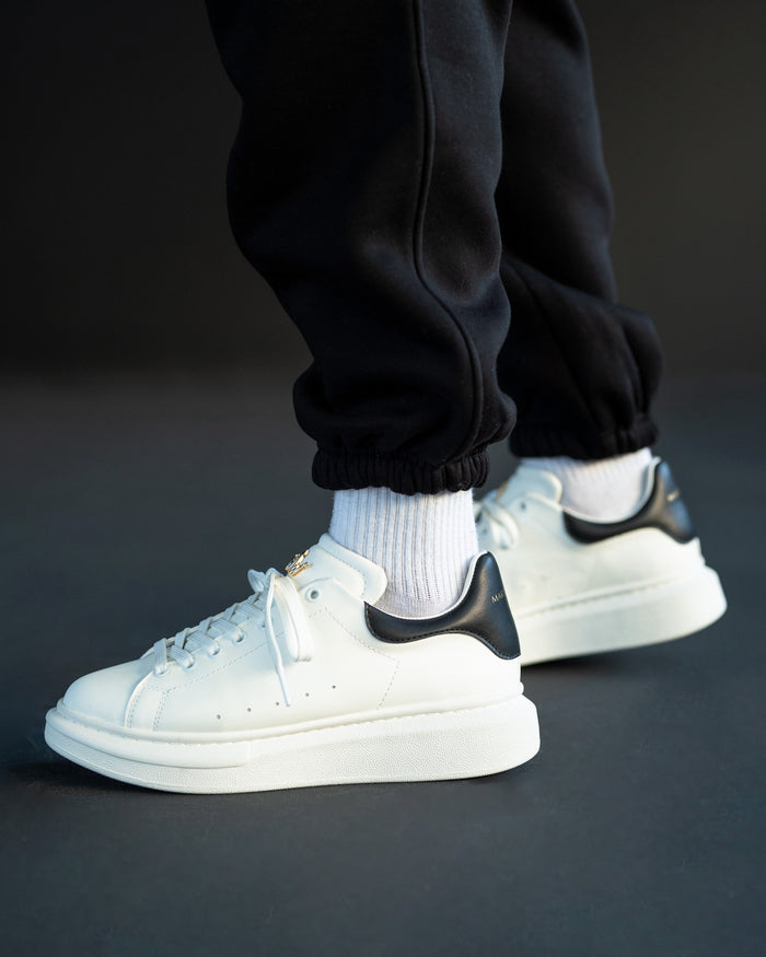 Martin Valen men’s Crowned white-black sneakers, close-up of ankle and inner heel from side angle