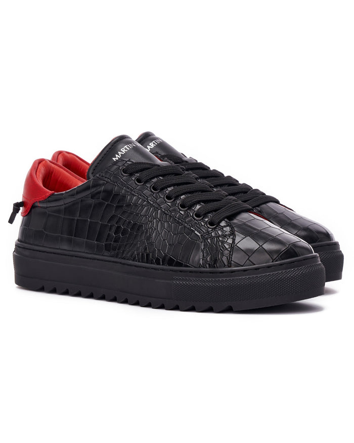 Martin Valen men's low-top black-red sneakers, high three-quarter view showing logo on tongue and lace details
