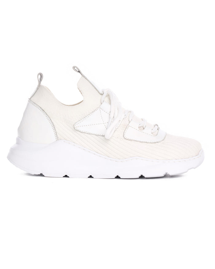 Martin Valen men's white knitted sneaker, close side view showing ribbed upper, laces and heel pull tab