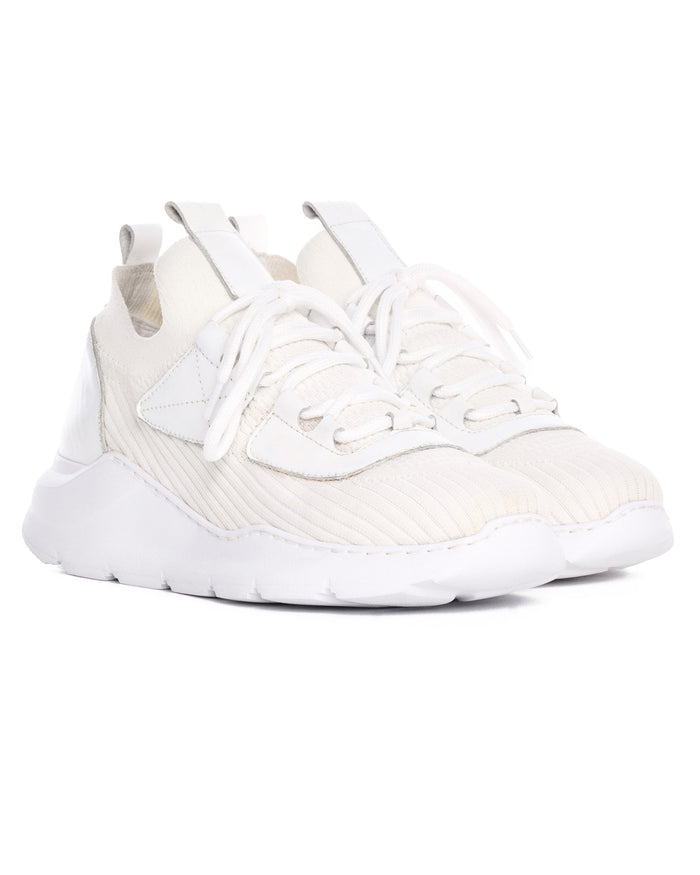 Pair of Martin Valen men's white knitted sneakers, side view showing white sole, stitched panels and tied laces