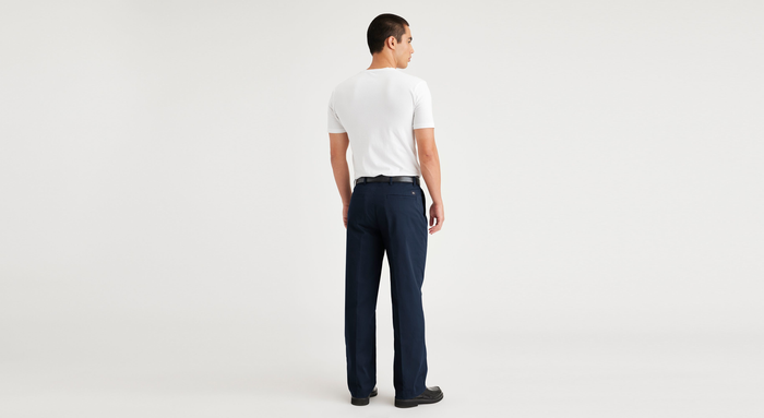 Back view of model wearing Navy Blazer Essential Chinos, Pleated, Classic Fit.