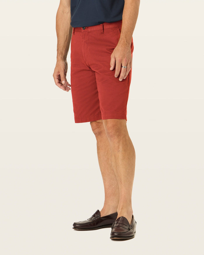 Side view of model wearing Bank Red Perfect 10.5" Shorts.