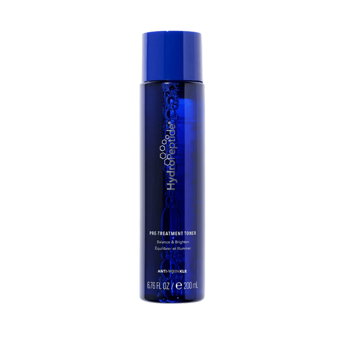 Bottle of Pre-Treatment Toner | HydroPeptide in deep blue packaging designed for skincare, promoting balance, brightness, and anti-wrinkle benefits.