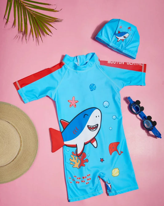 Children's one-piece swimwear with shark print, half sleeves and shorts, light blue; matching cap