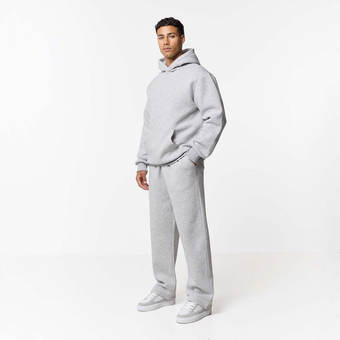 Model in loose fit tracksuit in grey marl