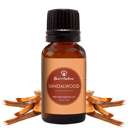 Sandalwood essential oil bottle with sandalwood pieces on a white background