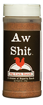 Black bottle label, white lettering, white cap and red chicken logo. Seasoning name; "Aw shit"