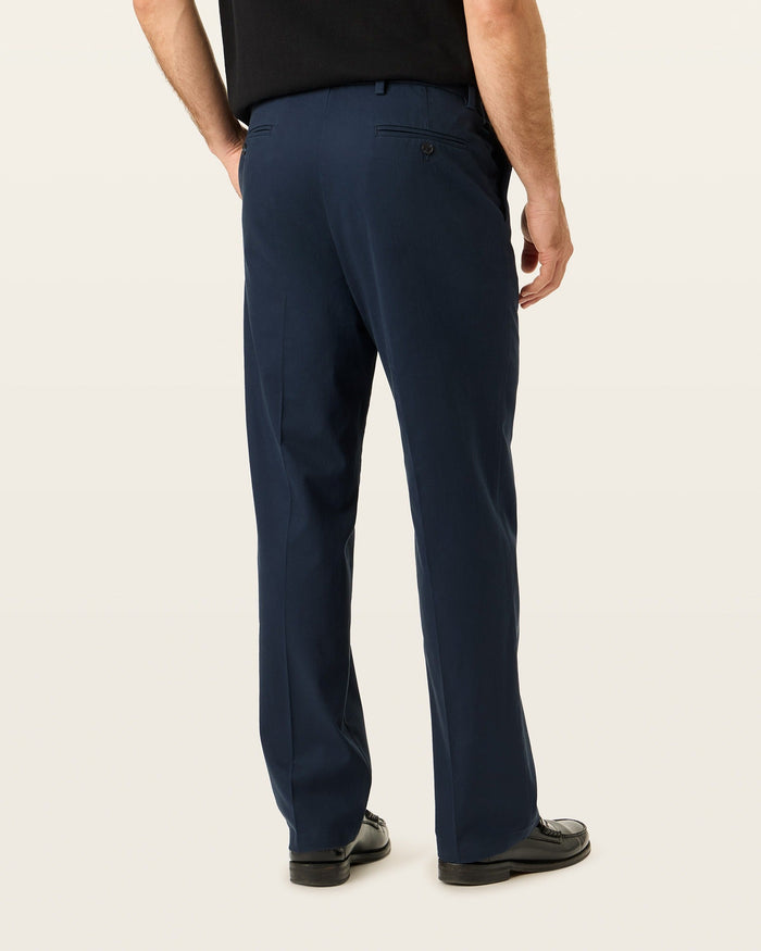 Back view of model wearing Navy Blazer Signature Iron Free Khakis, Relaxed Fit with Stain Defender®.