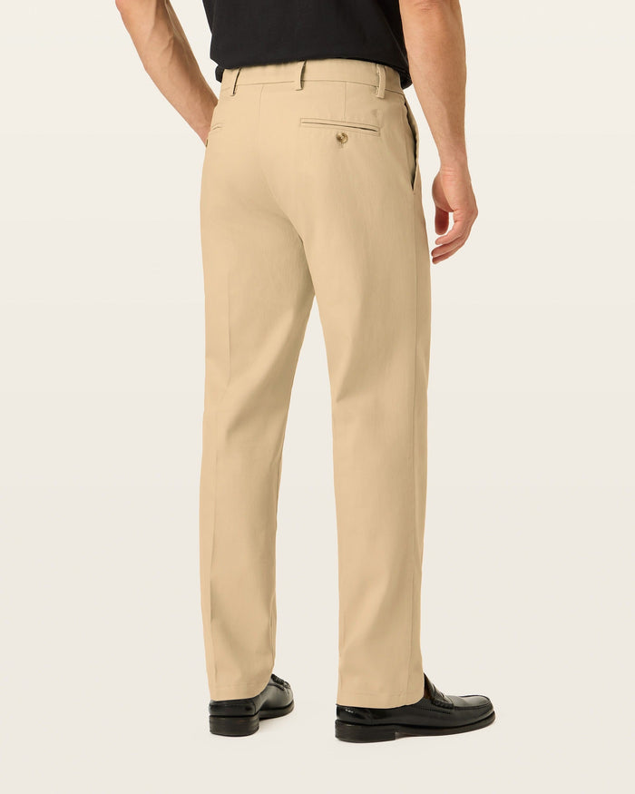 Back view of model wearing New British Khaki Signature Iron Free Khakis, Straight Fit with Stain Defender®.