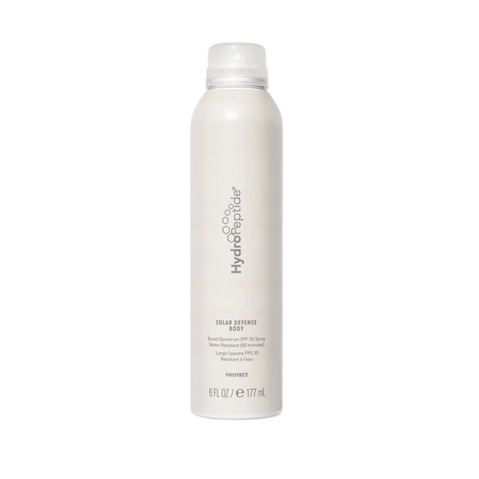 White spray bottle of Solar Defense Body SPF30 | HydroPeptide with minimalist branding, designed for skincare and body care protection.