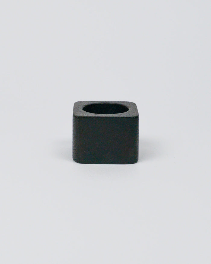 Dark wood square-shaped napkin ring on a white background