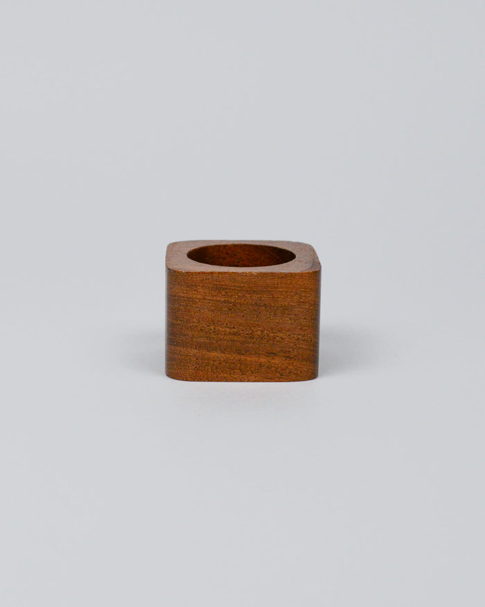 Light wooden squared napkin ring on a white background