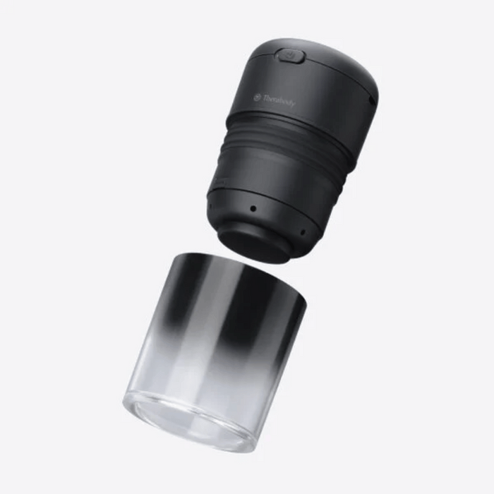 TheraCup | Therabody black handheld wellness device designed for muscle recovery with a sleek protective transparent cover, ideal for body care and recovery tools.
