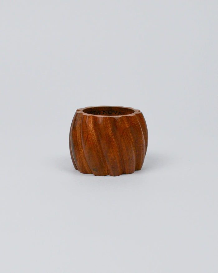 Wooden carved napkin ring on white background