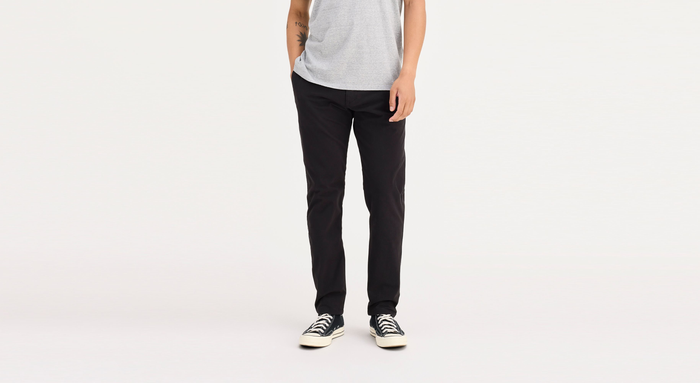 Front view of model wearing Black Ultimate Chinos, Athletic Fit.