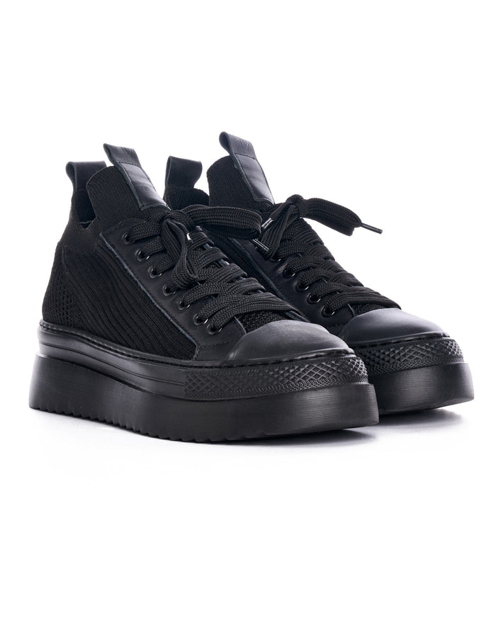 Martin Valen Valento black knitwear sneakers front three-quarter view of a pair with tied black laces, rubber toe caps and chunky soles