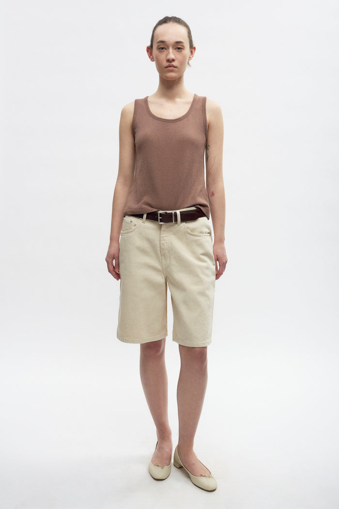 Elizabeth is 5’11" is a regular XS and is wearing an XS.