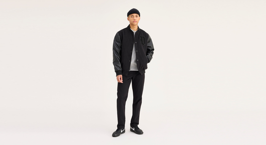 View of model wearing Black Workday Khakis, Slim Fit.