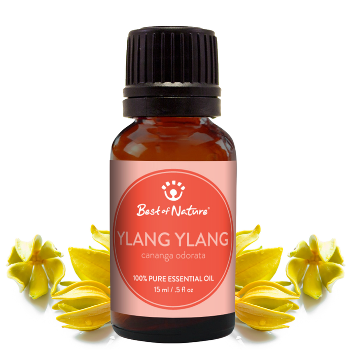 Ylang ylang essential oil bottle with flowers on a white background